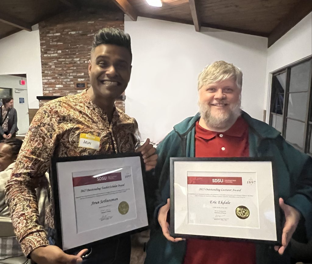 Dr. Arun Sethuraman (left); Dr. Erik Ekdale (right), with awards from the Department of Biology.